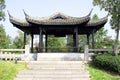 Chinese summer terrace on a hill. The architecture is oriental beautiful style with black round columns. Eastern construction Royalty Free Stock Photo