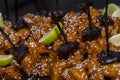 Chinese sweet sesame chicken with plums and lemon