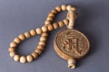 Chinese symbol of chi energy is carved on a medallion of wood