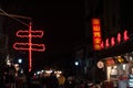 Chinese symbol for kebab chuan displayed as a red neon sign outside a restaurant in a Beijing street