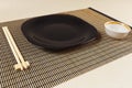 Chinese table set and chopsticks on bamboo mat