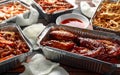 Chinese takeaway food. Crispy shredded beef, sweet and sour chicken wings, egg noodles with bean sprouts, pineapple Royalty Free Stock Photo