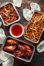 Chinese takeaway food. Crispy shredded beef, sweet and sour chicken wings, egg noodles with bean sprouts, pineapple Royalty Free Stock Photo