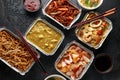 Chinese takeaway food. Pork Wonton dumpling soup, Crispy shredded beef, sweet and sour pineapple chicken, egg noodles Royalty Free Stock Photo