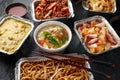 Chinese takeaway food. Pork Wonton dumpling soup, Crispy shredded beef, sweet and sour pineapple chicken, egg noodles Royalty Free Stock Photo