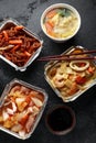 Chinese takeaway food. Pork Wonton dumpling soup, Crispy shredded beef, sweet and sour pineapple chicken, egg noodles Royalty Free Stock Photo