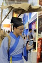 Chinese taoist priest using smart phone tencent wechat