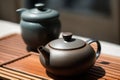 Chinese tea ceremony. Ceramic teapot made of clay and bowls. Generative ai Royalty Free Stock Photo