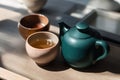 Chinese tea ceremony. Ceramic teapot made of clay and bowls. Generative ai Royalty Free Stock Photo