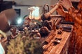 Tradition, health, harmony. Chinese tea ceremony. Tea master in kimono performs in the dark room with a wooden interior