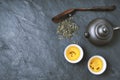 Chinese teapot and bowl with green tea on the stone background horizontal Royalty Free Stock Photo