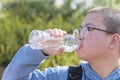 Chinese teen drinking water outdoor
