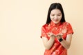 Chinese teen girl hand giving donation posture dressing traditional dress with space for text