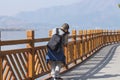 Chinese teen taking picture with winding handrail