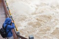 Chinese teen taking pictures about surging river