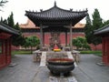 Chinese Temple with a God and an Incense Burner Royalty Free Stock Photo
