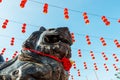 Chinese temple lion statue with red lantern Royalty Free Stock Photo