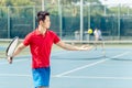 Chinese tennis player ready to hit the ball while serving Royalty Free Stock Photo