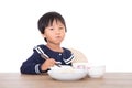 Chinese three-year-old girl eating on white