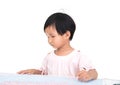 Chinese three-year-old girl is looking at the map seriously