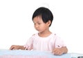 Chinese three-year-old girl is looking at the map seriously