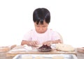 Chinese three-year-old girl is making moon cakes for the Mid-Autumn Festival