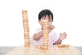 Chinese three-year-old girl playing with Chinese chess pieces enthusiastically