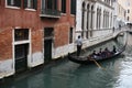 Chinese Tourism sailing travel by Gondola at Grand Canal Venice surrounding by historical attractive building, Venice, Italy