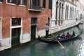 Chinese Tourism sailing travel by Gondola at Grand Canal Venice surrounding by historical attractive building, Venice, Italy