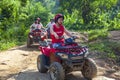 Chinese tourists on ATVs