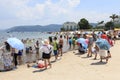 Chinese tourists on a beach of the Fuxian Lake in Yunnan, the thid deepest lake in China. It is located halfwy between the capital Royalty Free Stock Photo