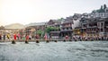 Chinese tourists on bridge over Tuo Jiang river and old fortification in background in phoenix ancient town in Hunan China Royalty Free Stock Photo