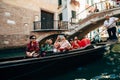 chinese tourists in gondola on the Grand Canal, Italy