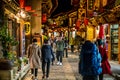 Chinese tourists in the pedestrian shopping street of Dukezong old town illuminated at night in Shangri-La Yunnan China