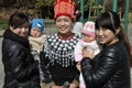 Chinese Tourists Posing with Jingpo Lady, China