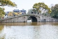 A Chinese traditional arch bridge in the lake in the Putuoshan, Zhoushan Islands,  a renowned site in Chinese bodhimanda of the Royalty Free Stock Photo