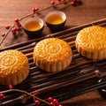 Chinese traditional pastry Moon cake Mooncake with tea cups on bamboo servingwarning tray on wooden background for Mid-Autumn Royalty Free Stock Photo