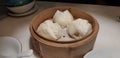 Chinese steamed buns in a bamboo steamer