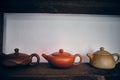 Chinese traditional yixin clay teapots on the shelves in the tea house Royalty Free Stock Photo