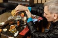 Chinese traditions. Master man brews tea at the ceremony Royalty Free Stock Photo