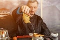 Chinese traditions. Master man brews tea at the ceremony Royalty Free Stock Photo