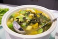 Chinese vegetable soup in big white bowl. asian food for vegan people and diet.