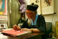 Beijing China - June 8, 2018: Chinese predictor and astrologer makes horoscope for the tourist.