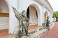 The Chinese Warrior Stone Statues stand near the door in Thai temple, focus selective