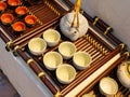 Chinese white teapot and teacups on the wooden trivet Royalty Free Stock Photo