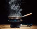 Chinese wok pan on fire gas burner Royalty Free Stock Photo