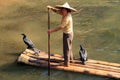 Chinese woman on a bamboo raft on the Li River Royalty Free Stock Photo