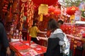 A Chinese woman is buying crafts at the Chinese new year market