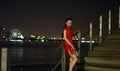 Chinese woman in cheongsam by Jinji lake