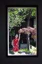 Chinese woman in cheongsam in Mudu ancient town, the picture looks like picture in picture Royalty Free Stock Photo